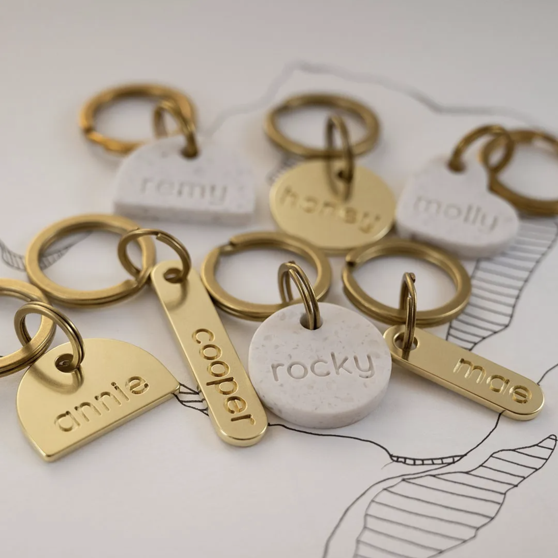 Onoma Premium Pet Tags in Brass and Stone via Onoma Pet Tags (Image via Instagram @onoma.tags)
